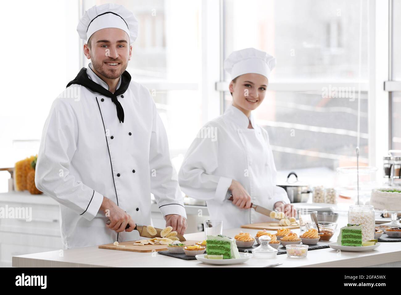 Chefs cutting banana on a wooden boards Stock Photo Alamy