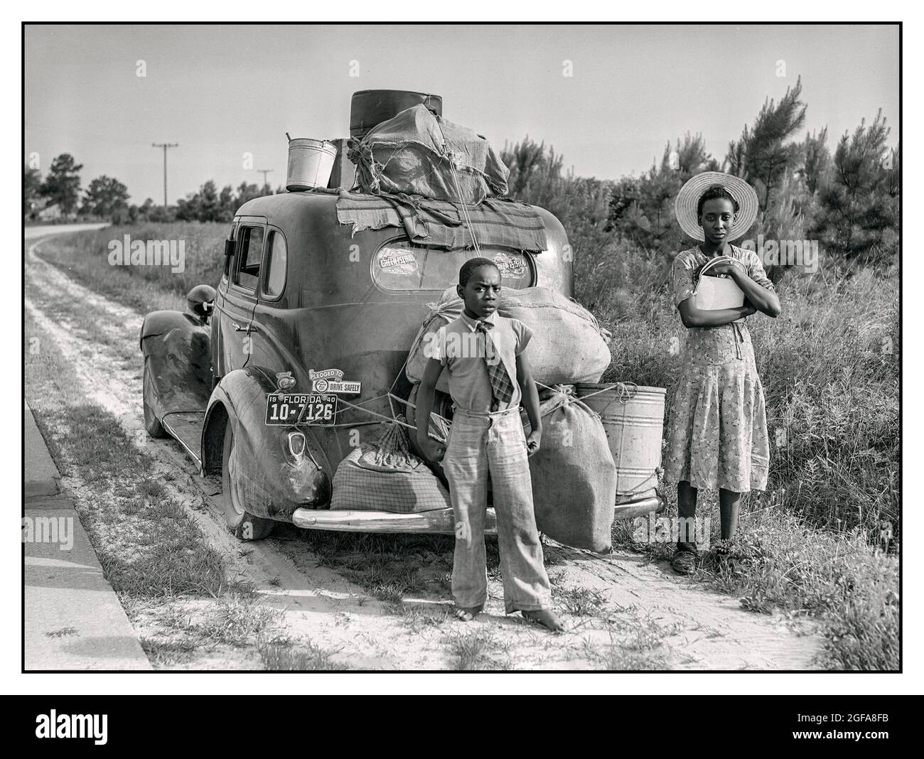 Migrant Workers African American July 1940. 'North Carolina. Mother & son Florida migrants on their way to Cranbury New Jersey, to pick potatoes.'  Photo by Jack Delano for the Farm Security Administration LOC  America USA Stock Photo