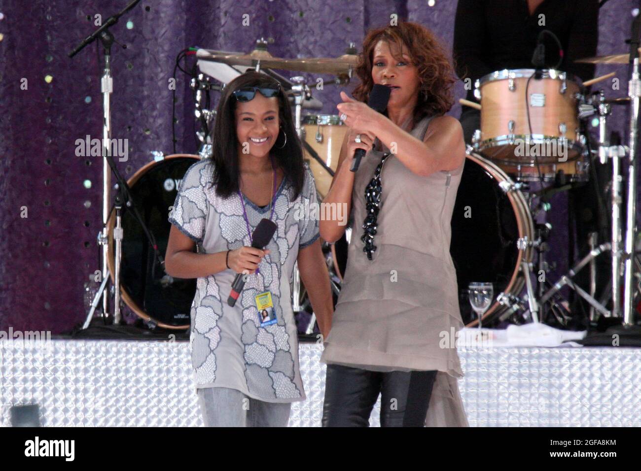 Whitney Houston and daughter Bobbi Kristina Brown performing on ABC's 'Good Morning America' at Central Park's Rumsey Playfield in New York City on September 1, 2009.  Photo Credit: Henry McGee/MediaPunch Stock Photo