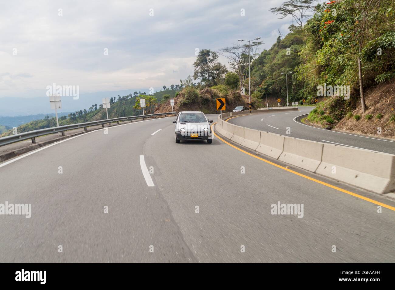 MANIZALES, COLOMBIA - SEPTEMBER 6, 2105: Traffic on Autopista del Cafe (Coffee Highway) connecting important coffee production areas in Colombia. Stock Photo