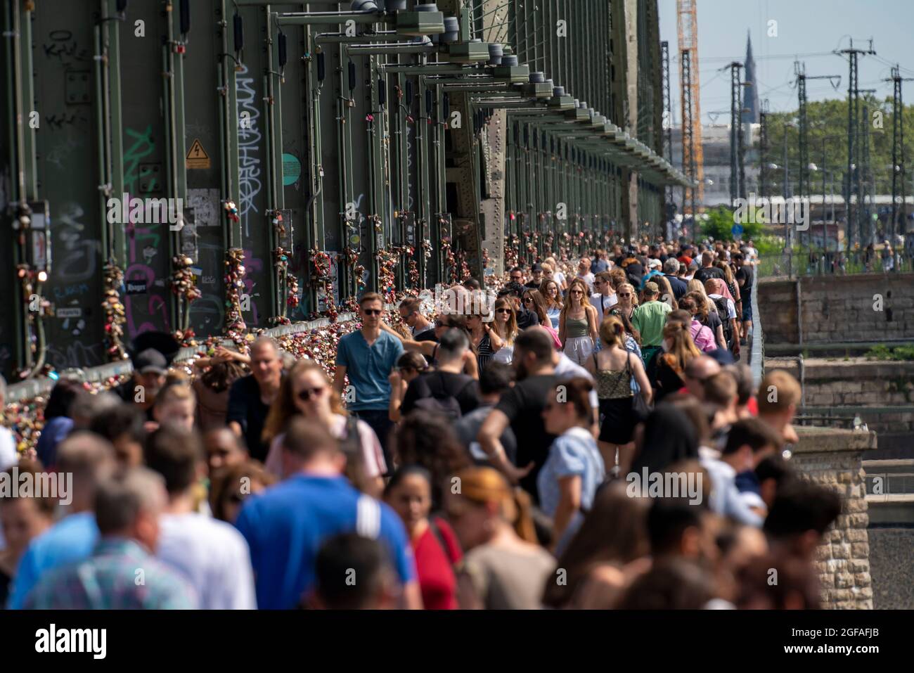 Many people on the Hohenzollern Bridge, footpath, railway bridge over the Rhine, Cologne, NRW, Germany, Stock Photo