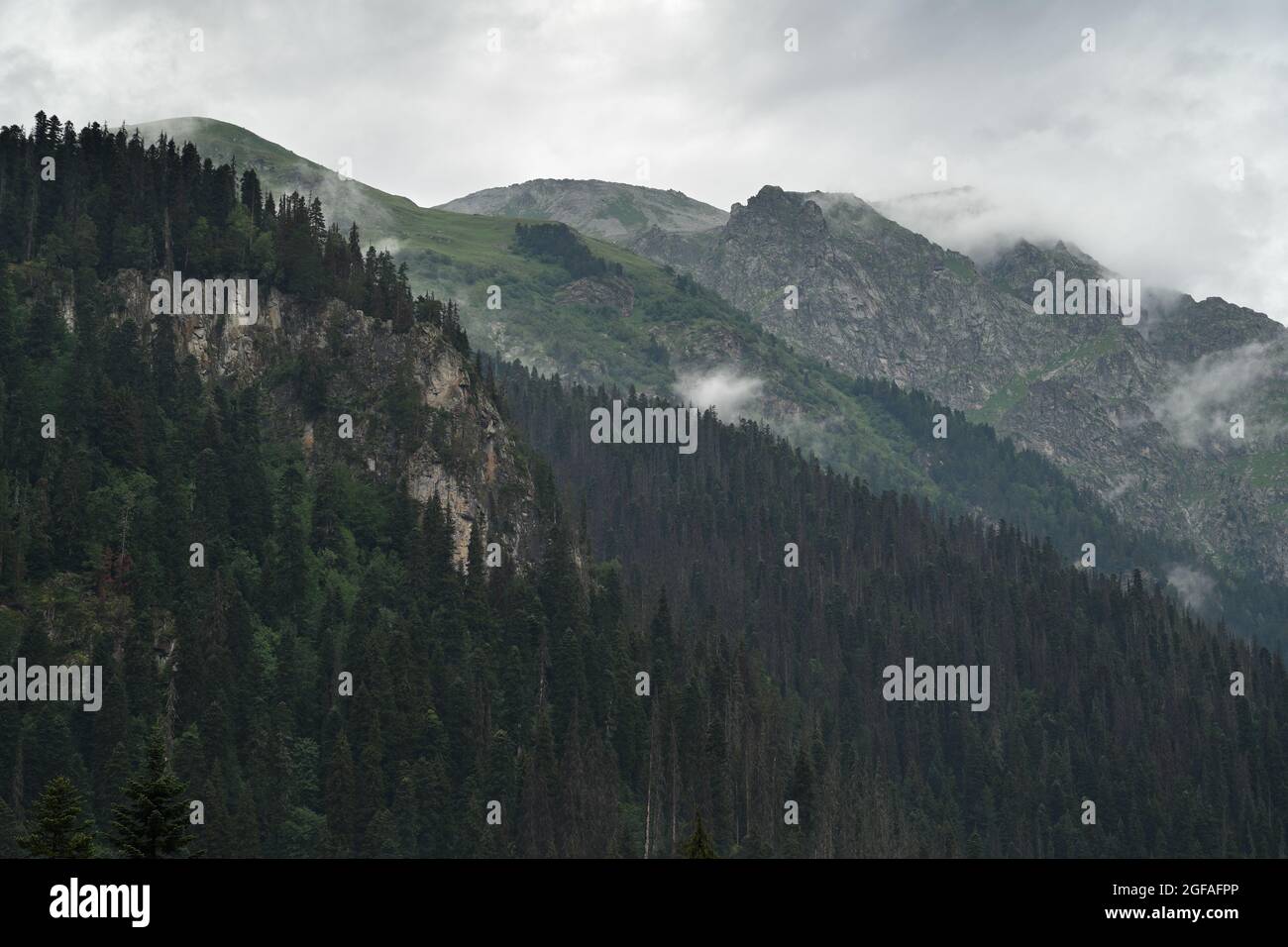 Misty cloudy alpine landscape hi-res stock photography and images - Alamy