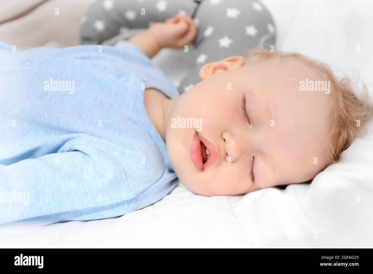 Baby sleeping on bed Stock Photo Alamy