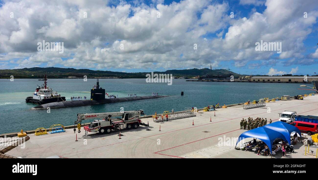 The U.S. Navy nuclear-power Los Angeles-class submarine USS Oklahoma City, returns to Naval Base Guam for the final time August 20, 2021 in Apra Harbor, Guam. The USS Oklahoma City is at the end of her life cycle and slated for decommissioning. Stock Photo