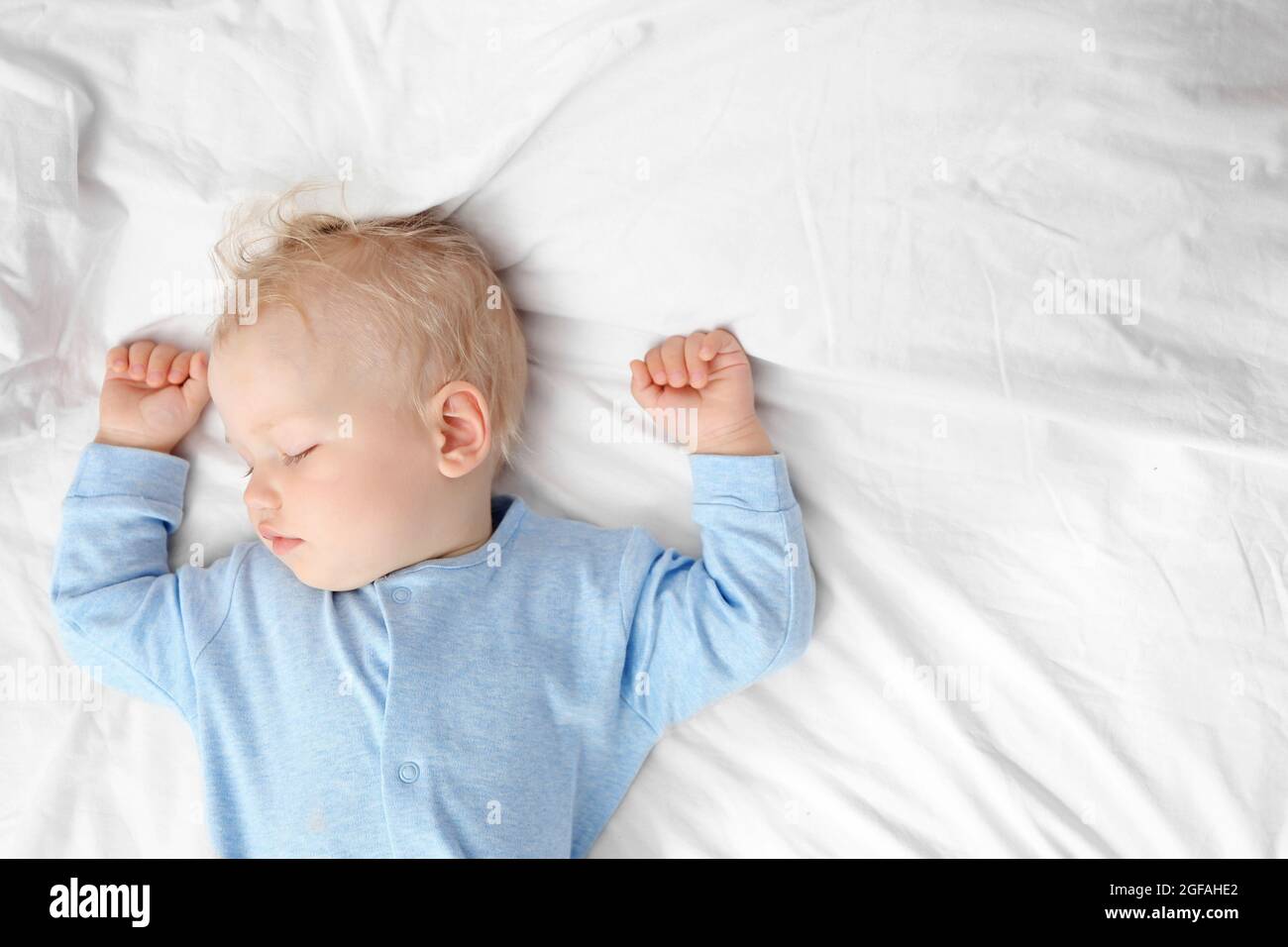 Baby sleeping on bed Stock Photo Alamy