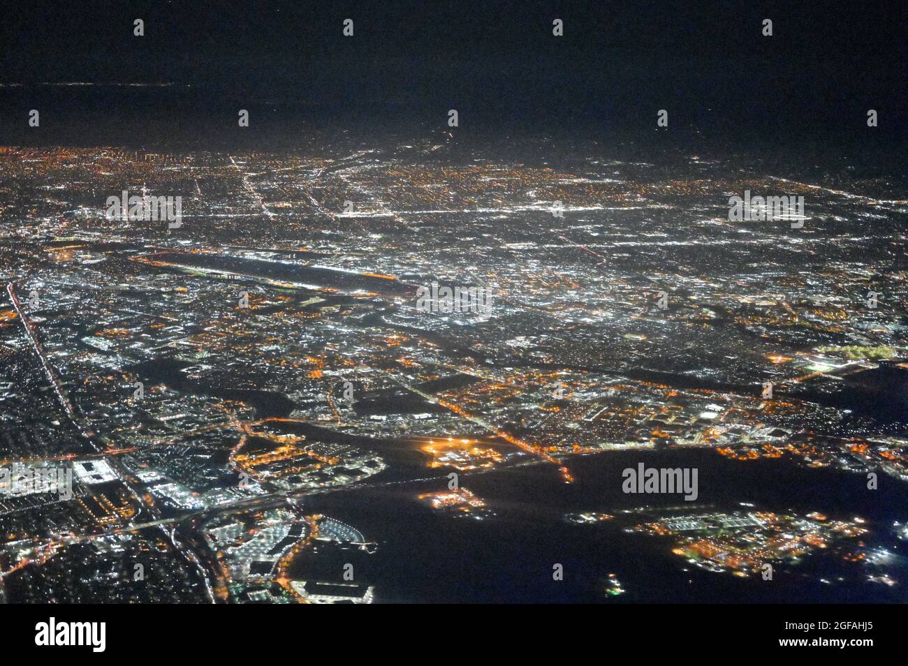 Aerial of the Silicon Valley glowing during nighttime, greater San Jose CA Stock Photo
