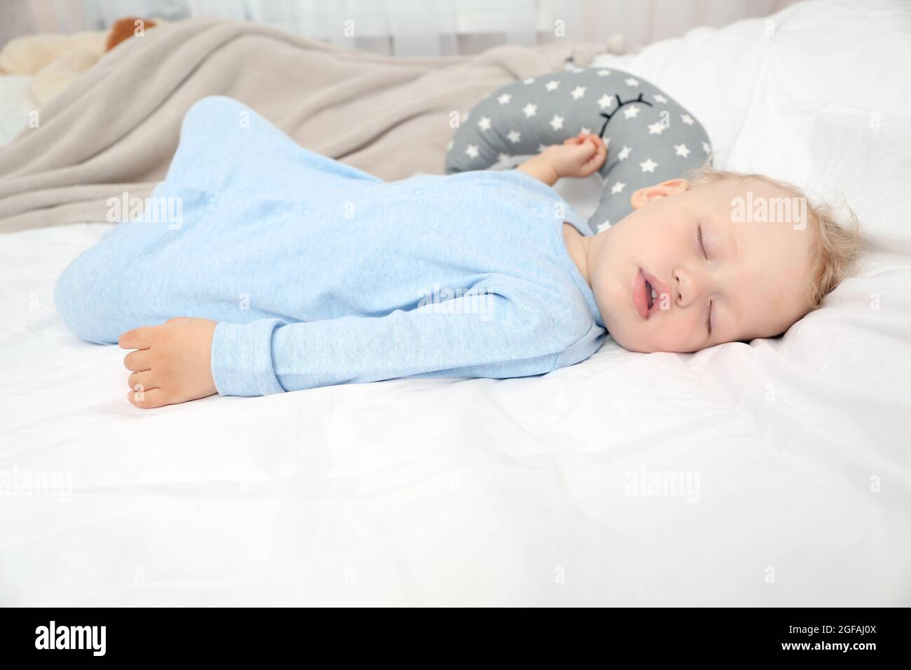 Baby sleeping on bed Stock Photo Alamy