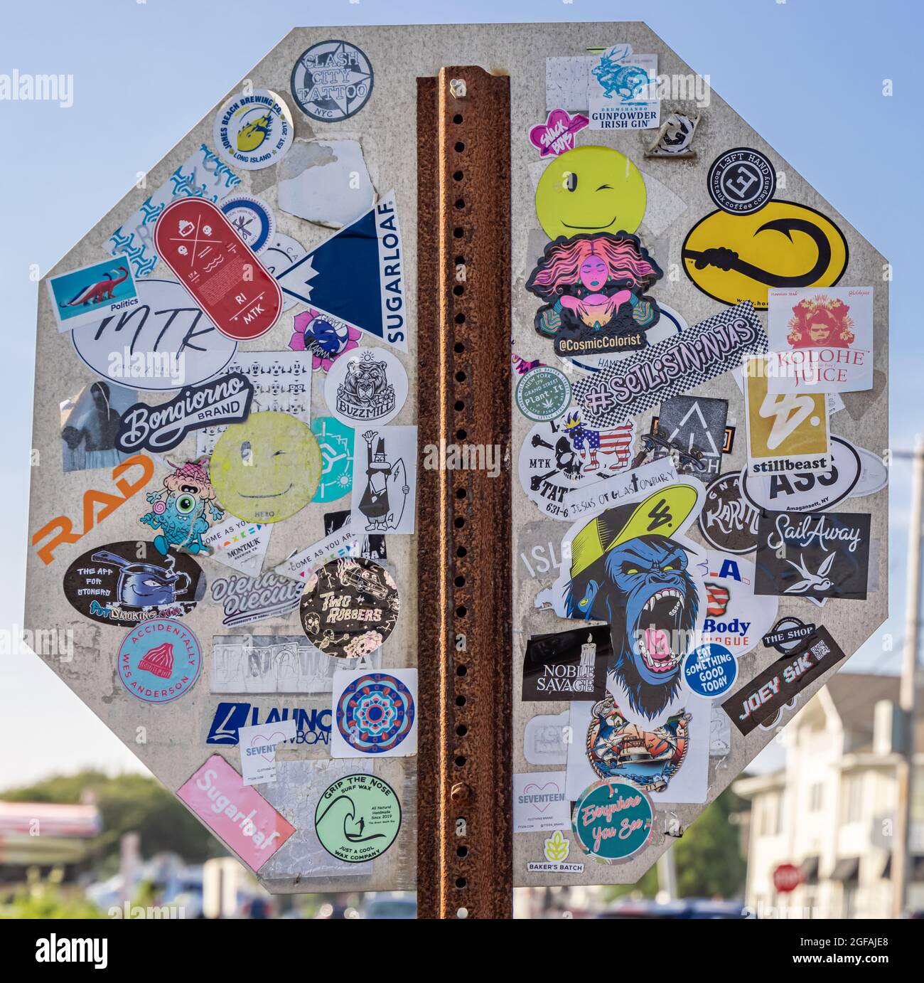 Stickers covering the back of a stop sign in Montauk, NY Stock Photo