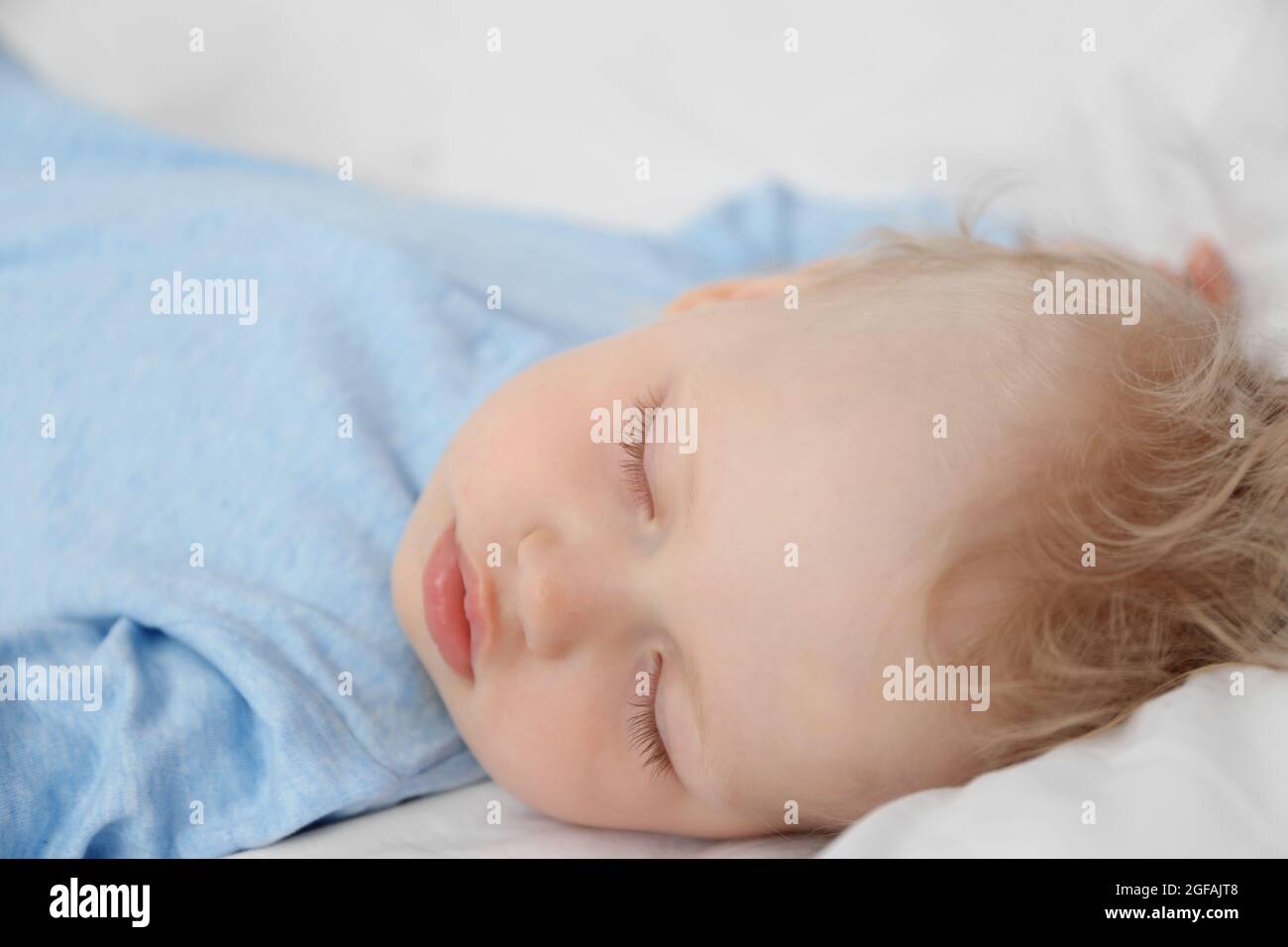 Baby sleeping on bed Stock Photo Alamy