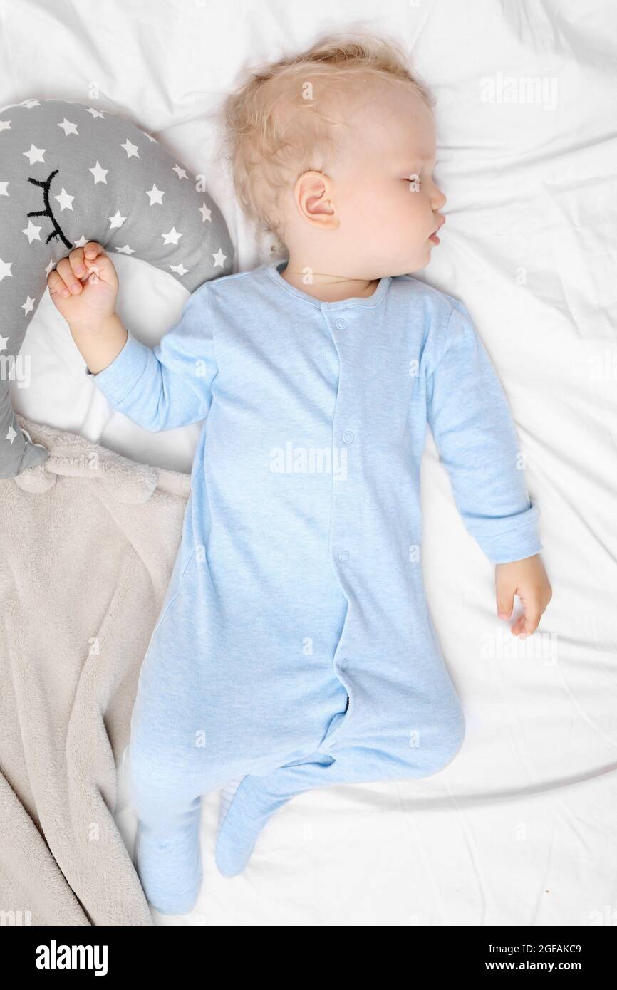 Baby sleeping on bed Stock Photo Alamy