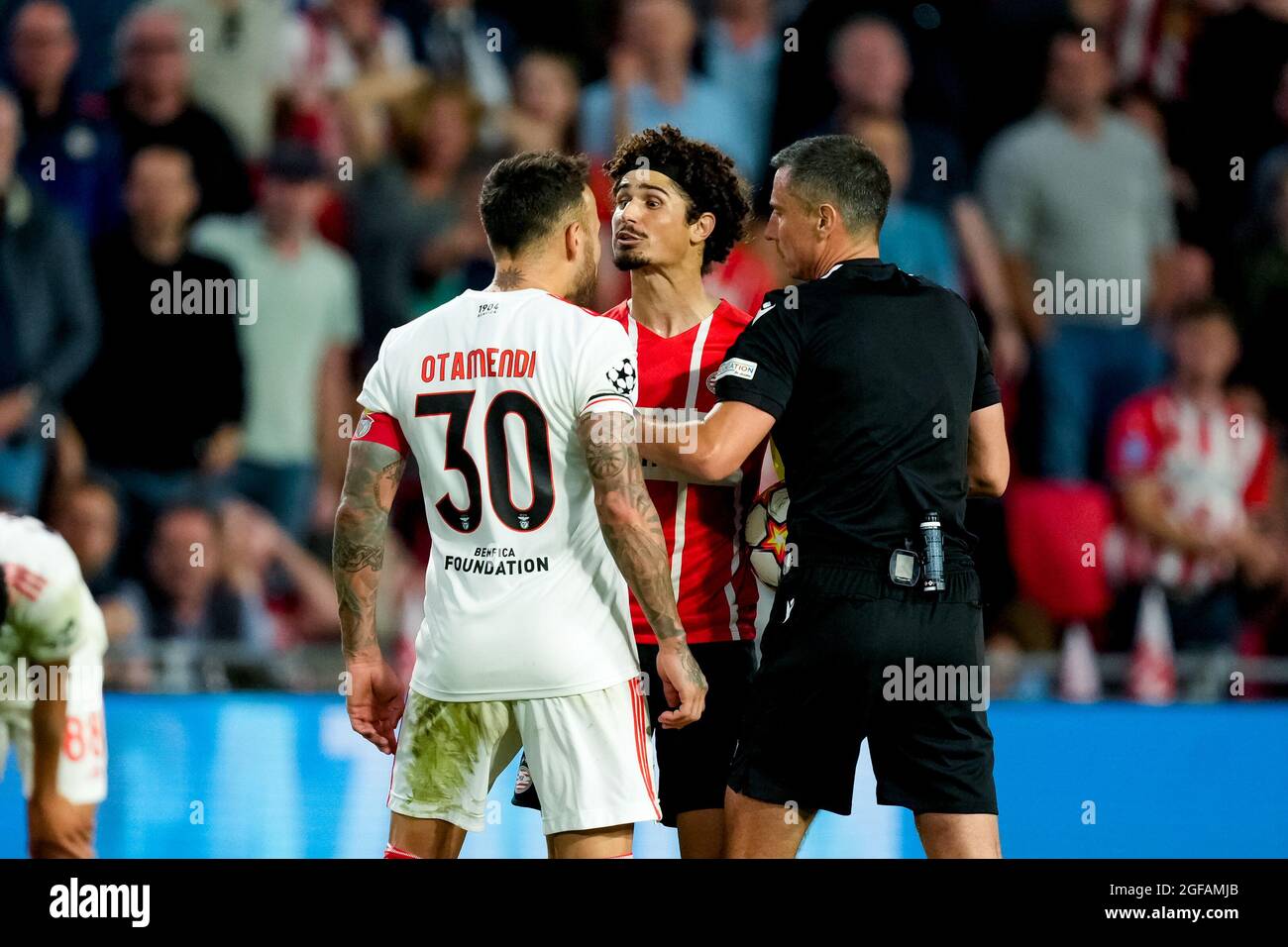 Eindhoven, Netherlands. 24th Aug, 2021. EINDHOVEN, NETHERLANDS - AUGUST 24: Nicolas Otamendi of Benfica, Referee Slavko Vincic and Andre Ramalho of PSV during the UEFA Champions League Play-Offs Leg Two match between PSV and Benfica at Philips Stadion on August 24, 2021 in Eindhoven, Netherlands (Photo by Geert van Erven/Orange Pictures) Credit: Orange Pics BV/Alamy Live News Stock Photo