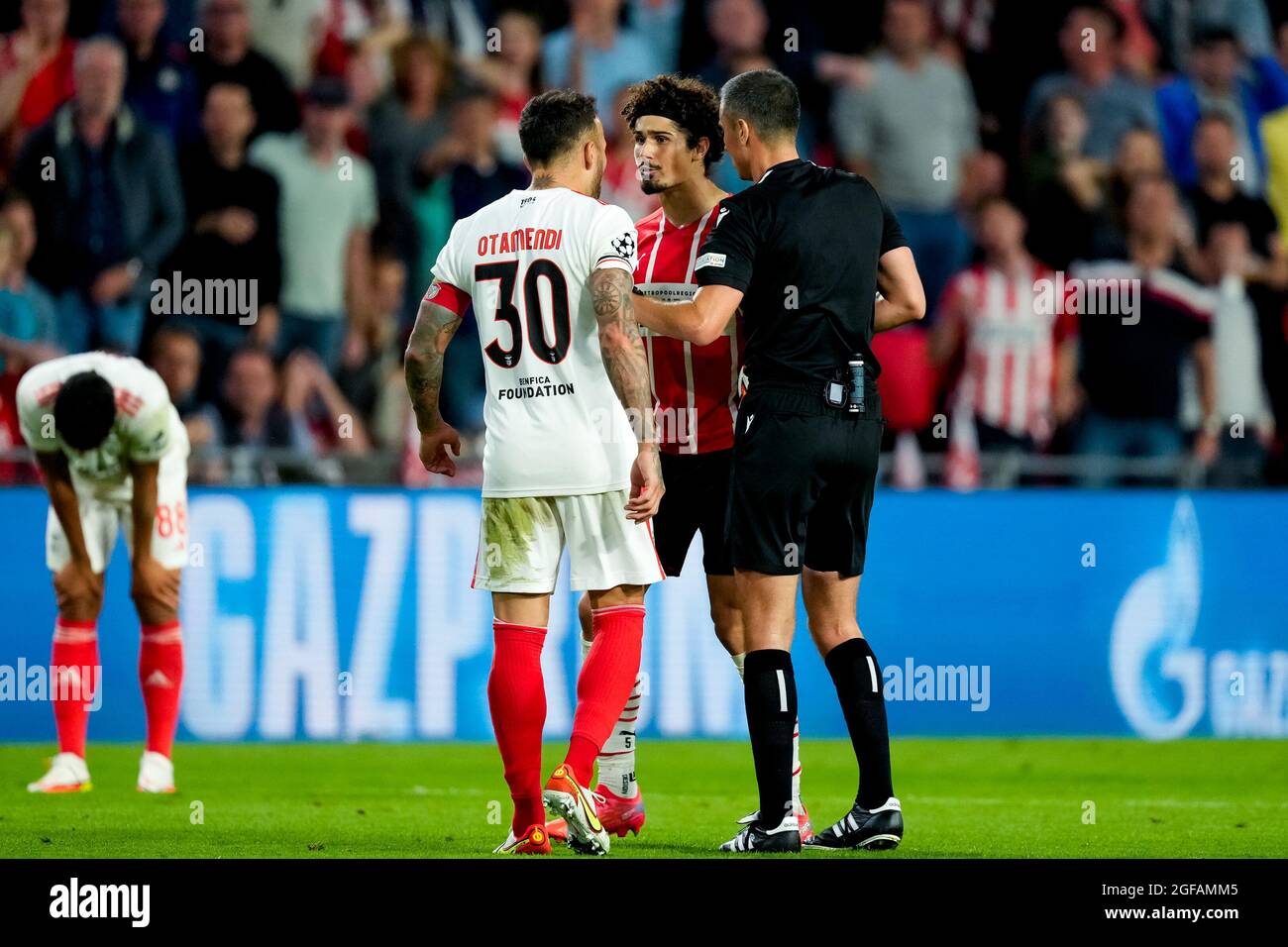 Eindhoven, Netherlands. 24th Aug, 2021. EINDHOVEN, NETHERLANDS - AUGUST 24: Nicolas Otamendi of Benfica, Referee Slavko Vincic and Andre Ramalho of PSV during the UEFA Champions League Play-Offs Leg Two match between PSV and Benfica at Philips Stadion on August 24, 2021 in Eindhoven, Netherlands (Photo by Geert van Erven/Orange Pictures) Credit: Orange Pics BV/Alamy Live News Stock Photo