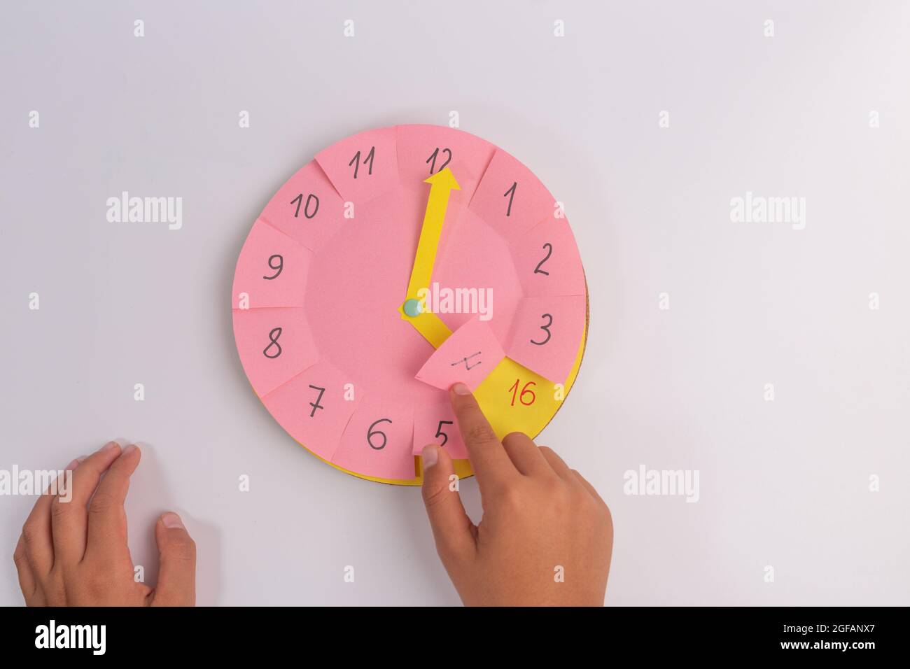 child learning time with paper handmade clock, preschool hour teaching