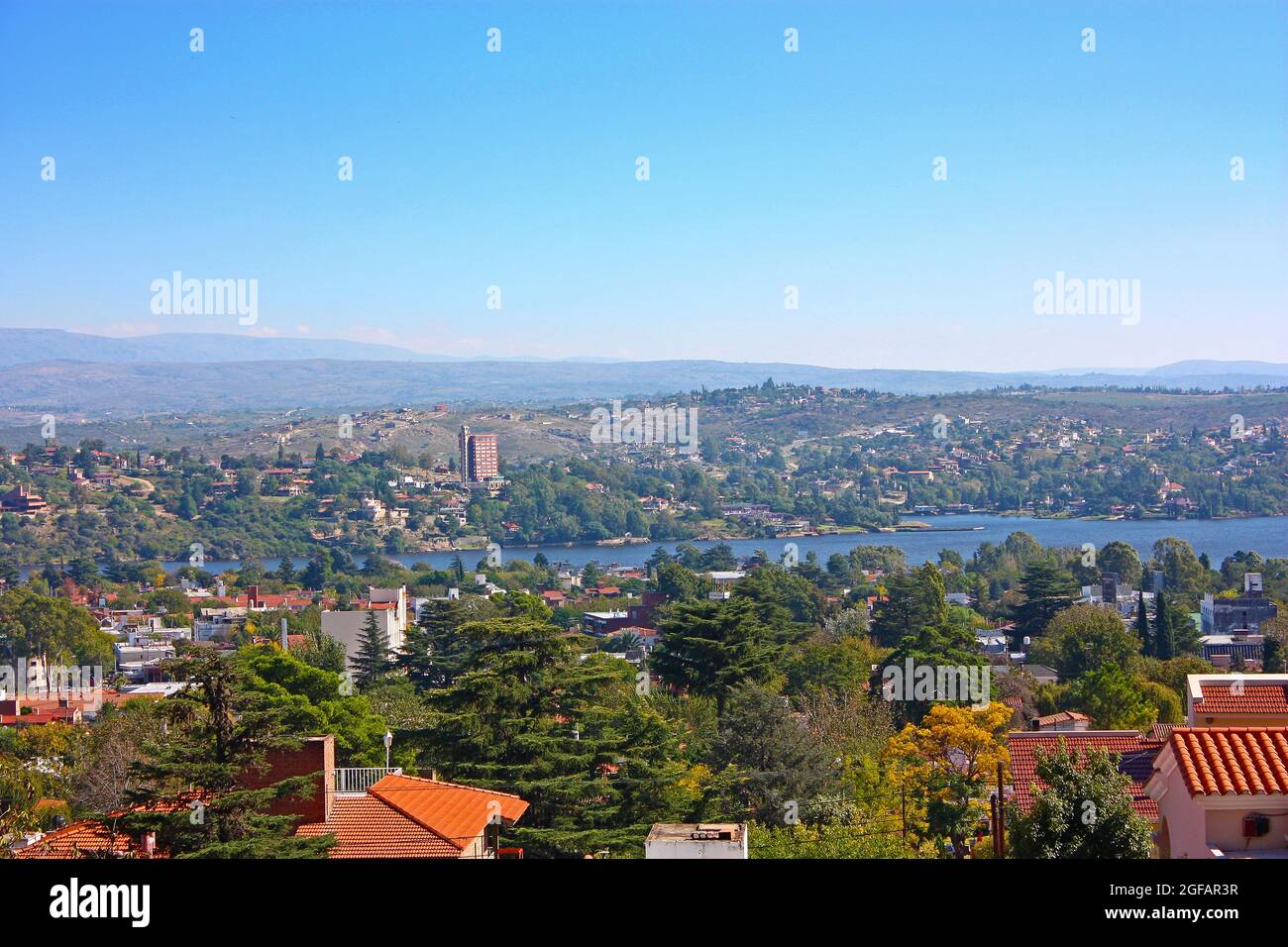 VILLA CARLOS PAZ, CORDOBA, ARGENTINA.Panoramic view from the top of a hill of the landscape of Carlos Paz Town in a sunny day. Stock Photo