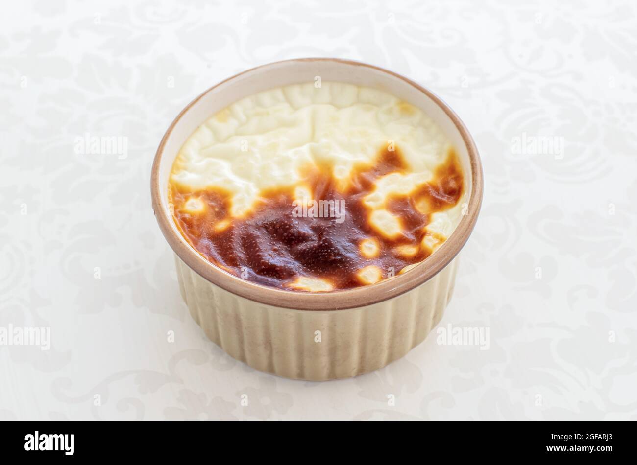 Bakery rice pudding. Turkish milky sweet sutlac in casserole Stock Photo