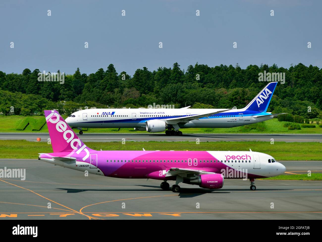 Peach, Airbus, A320, JA822P, ANA, Boeing, B-787-9, Take Off, Behind, Tokyo Narita Airport, Chiba, Japan Stock Photo