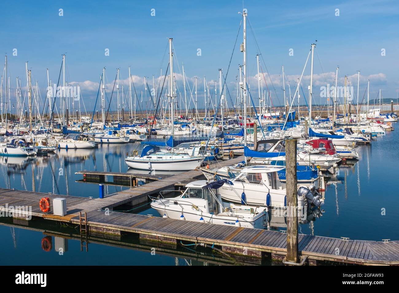 Troon marina with yachts and motor boats tied up at the floating