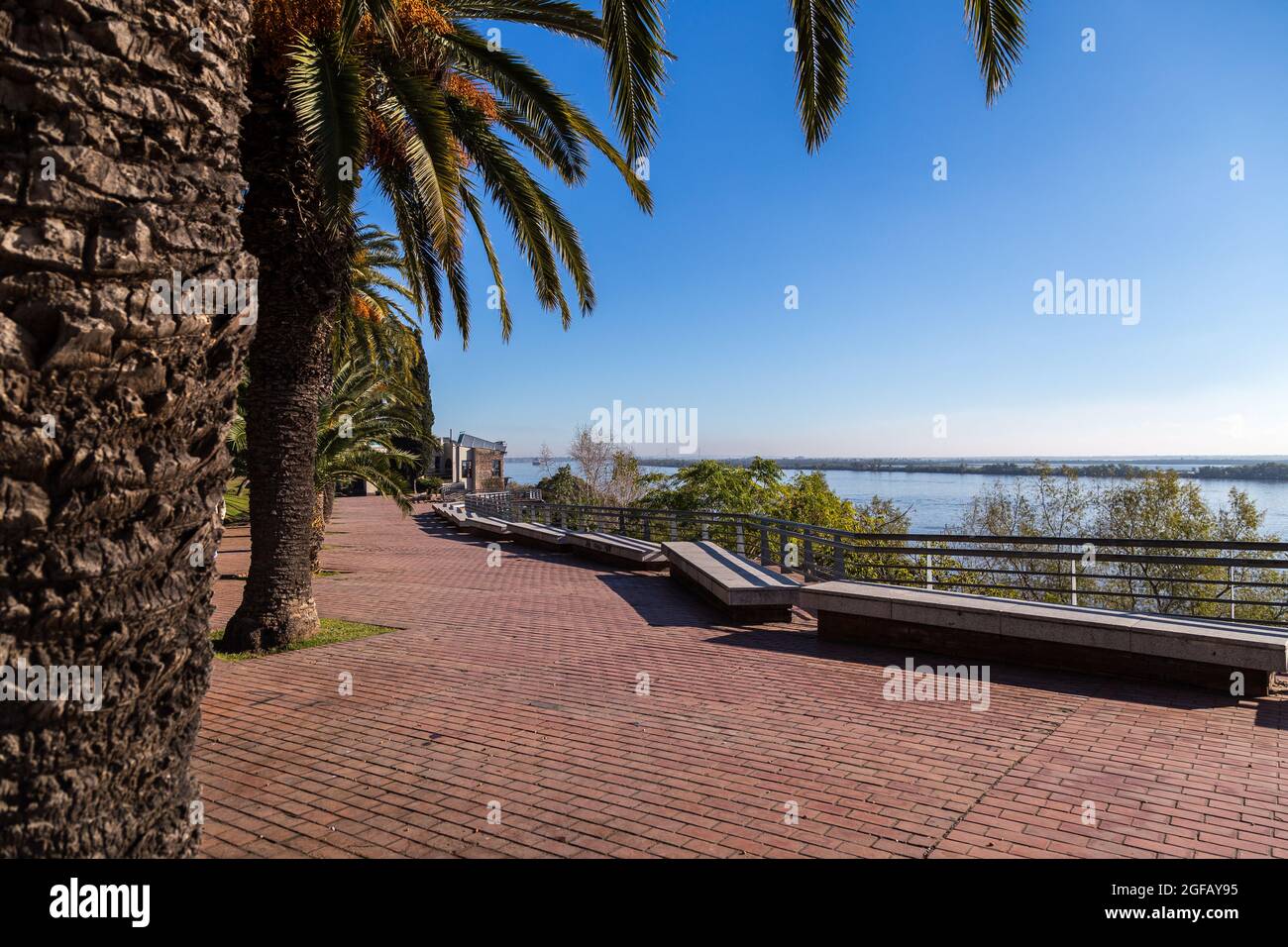 ROSARIO, ARGENTINA .Spain Park placed at the coast of Parana river in Rosario. Promenade walk with palms trees. Stock Photo