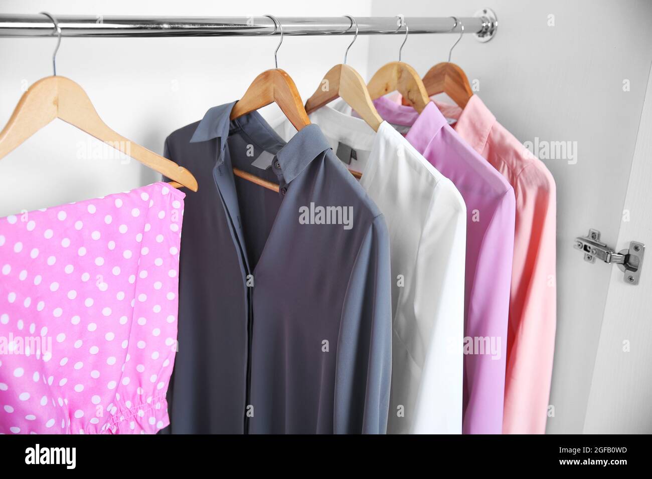 Female clothes hanging in wardrobe Stock Photo Alamy
