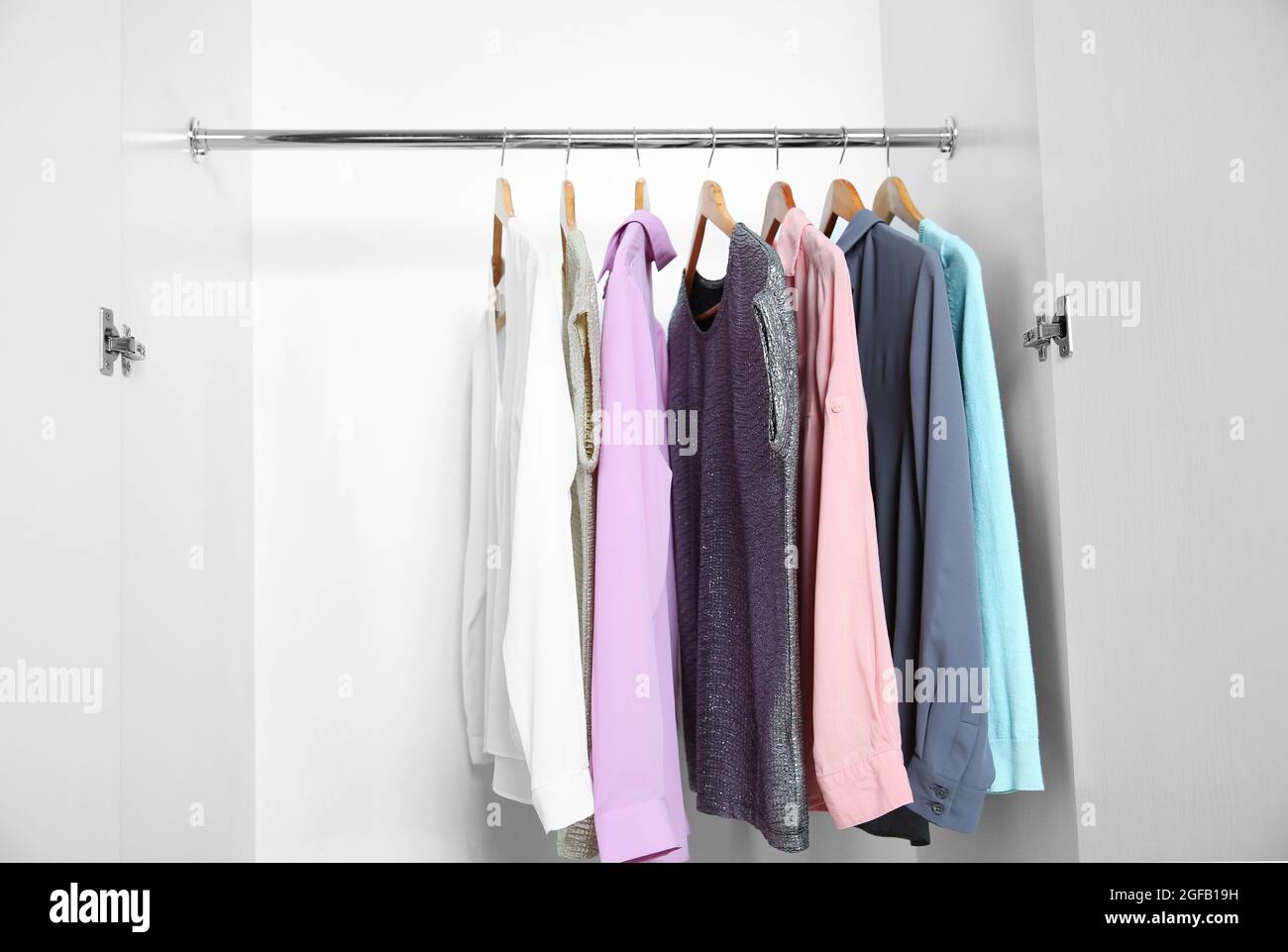 Female clothes hanging in wardrobe Stock Photo Alamy