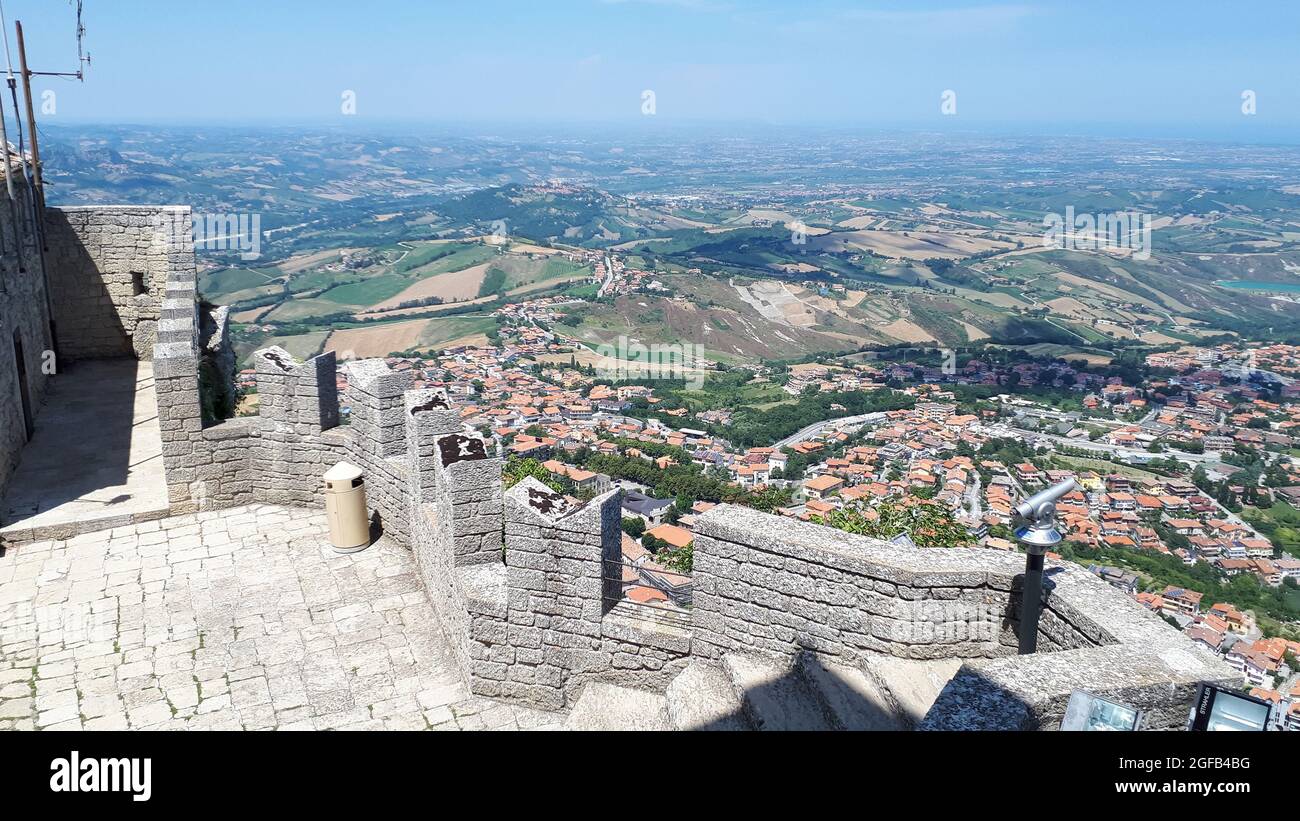 SAN MARINO, SAN MARINO - May 03, 2018: A shot of a brick fortress and a standpoint on it with a scenic city view in San Marino, Italy Stock Photo