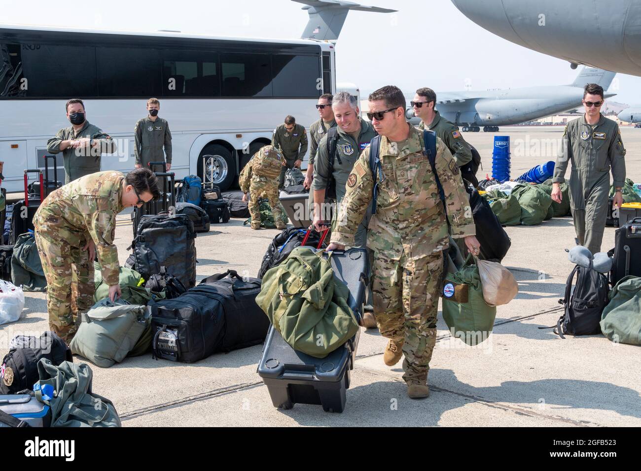 KC-10 Extender aircrew assigned to the 70th Air Refueling Squadron board a C-5M Super Galaxy Aug. 21, 2021, at Travis Air Force Base, California. Members of the 349th Air Mobility Wing deployed in support of the Afghanistan evacuation effort. The U.S. Air Force, in support of the Department of Defense, moved forces into theater to facilitate the safe departure and relocation of U.S. citizens, Special Immigration Visa recipients, and vulnerable Afghan populations from Afghanistan. (U.S. Air Force photo by Heide Couch) Stock Photo