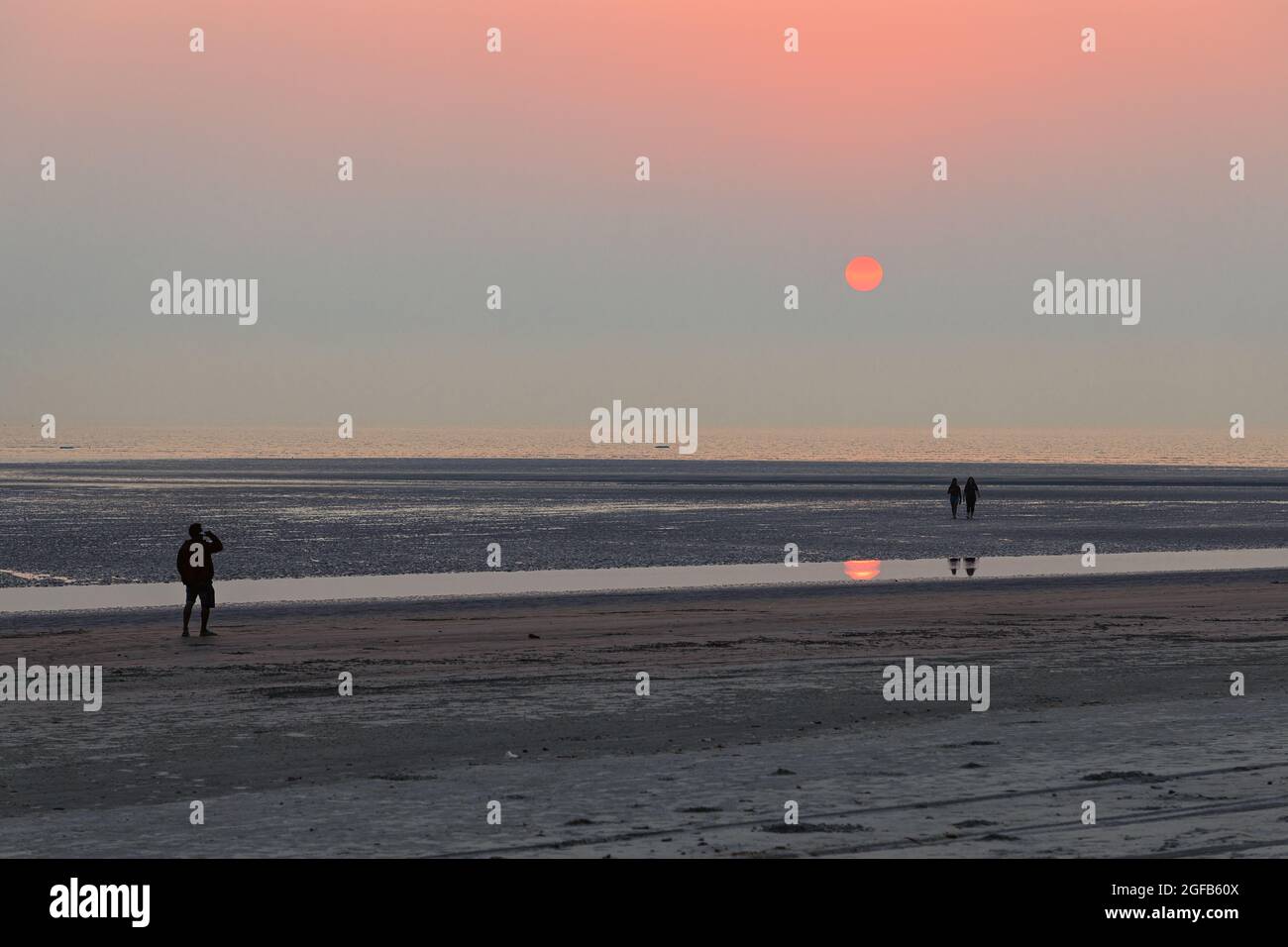Picture of a loan sea beach at the time of sunset  minimalist outdoor landscape travel photography Stock Photo