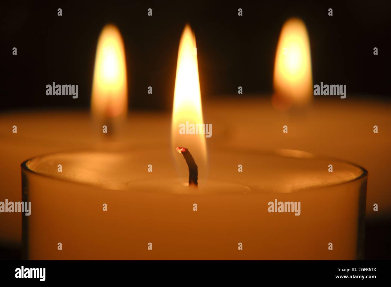 Candle flame. white candles . Burning candles in the dark.Closeup