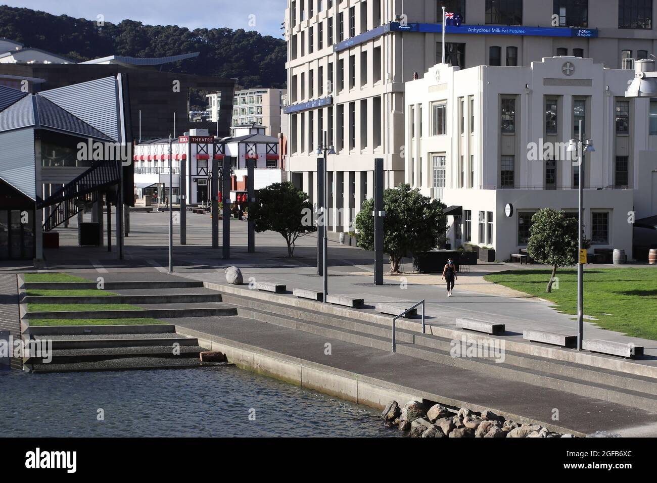 Wellington, New Zealand, 25 August 2021. A woman exercises in deserted central Wellington, New Zealand during a strict Level 4 lockdown due to a Covid-9 delta variant outbreak. Credit: Lynn Grieveson/Alamy Live News Stock Photo