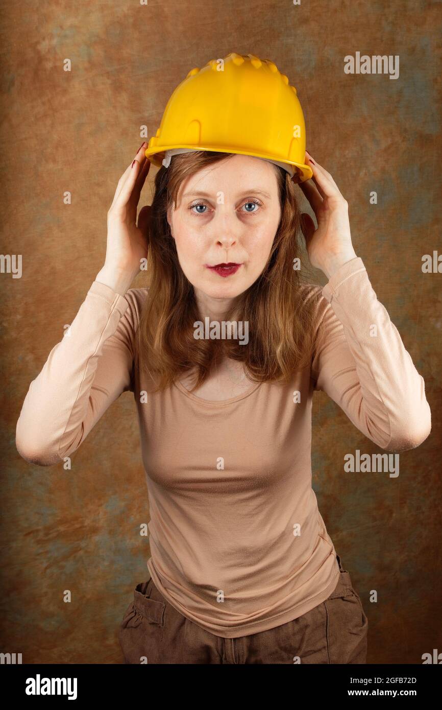 Young woman wearing protective helmet hi-res stock photography and ...