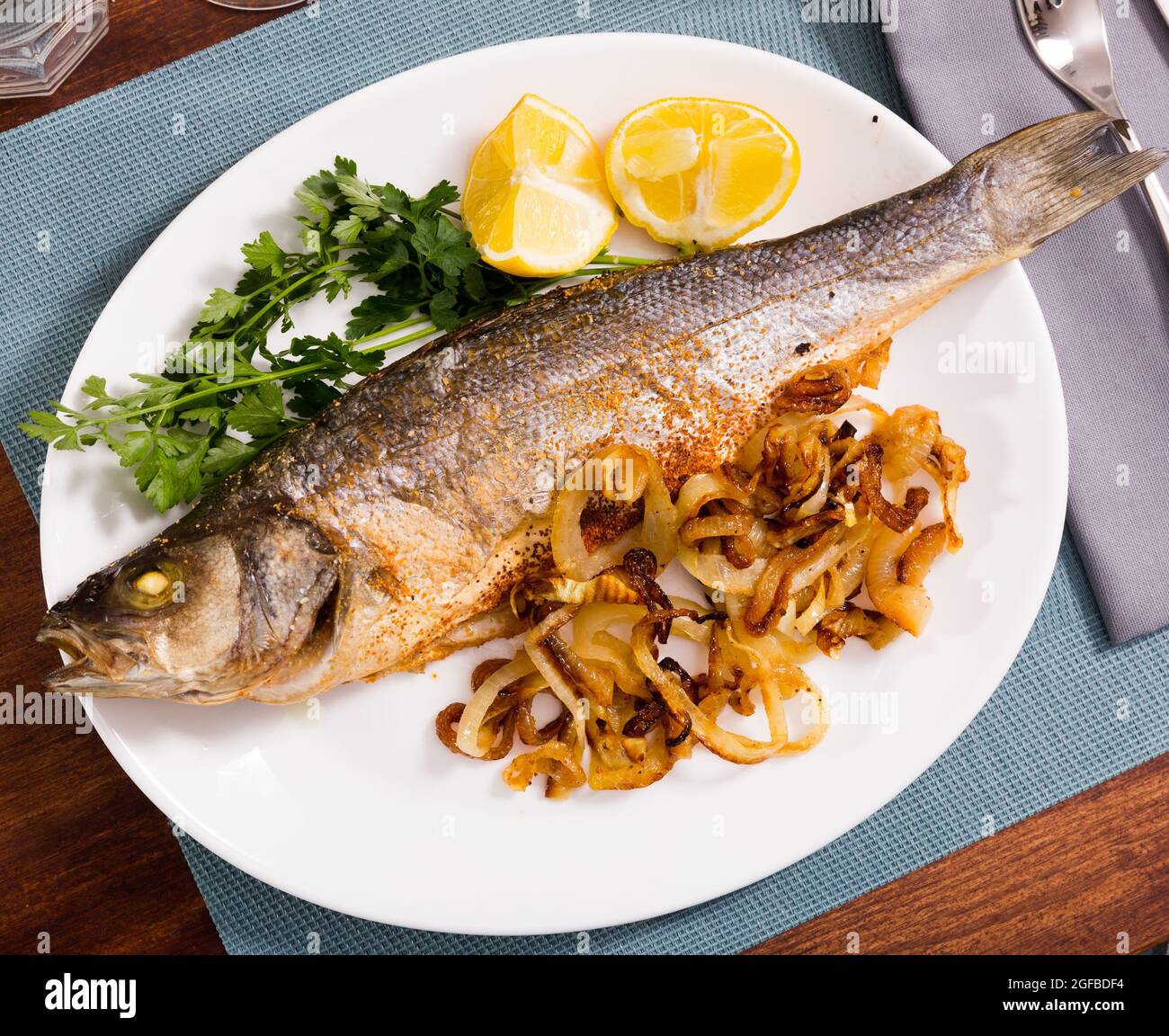 Oven baked sea bass fish Stock Photo Alamy