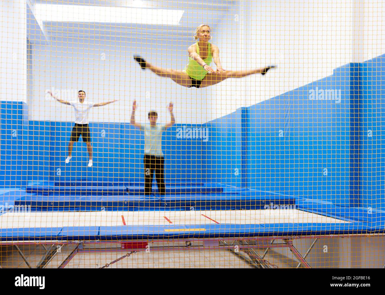 Sporty people exercising on trampoline Stock Photo