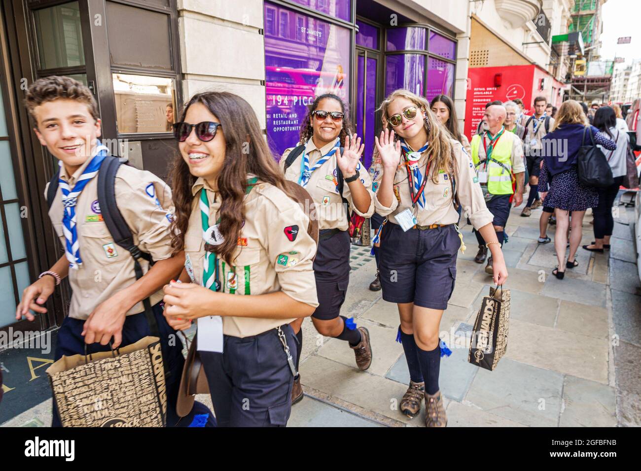 London England,UK West End St James's Portuguese Rover Scouts,Rover Crew boy male girls female teen teens teenagers,friends travel abroad field trip w Stock Photo