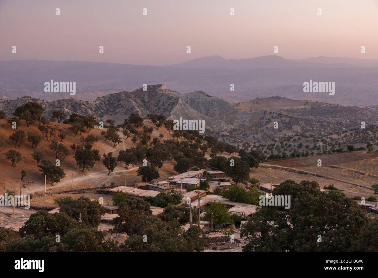 Evening glow of small village at highland, in Zagros mountains, near Dalin,  Fars province, Iran, Persia, Western Asia, Asia Stock Photo