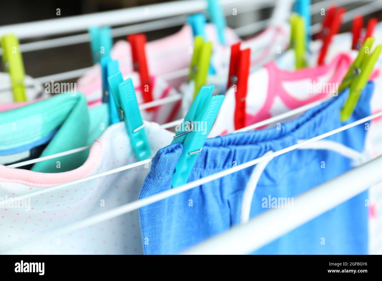 Drying baby clothes, close up Stock Photo Alamy