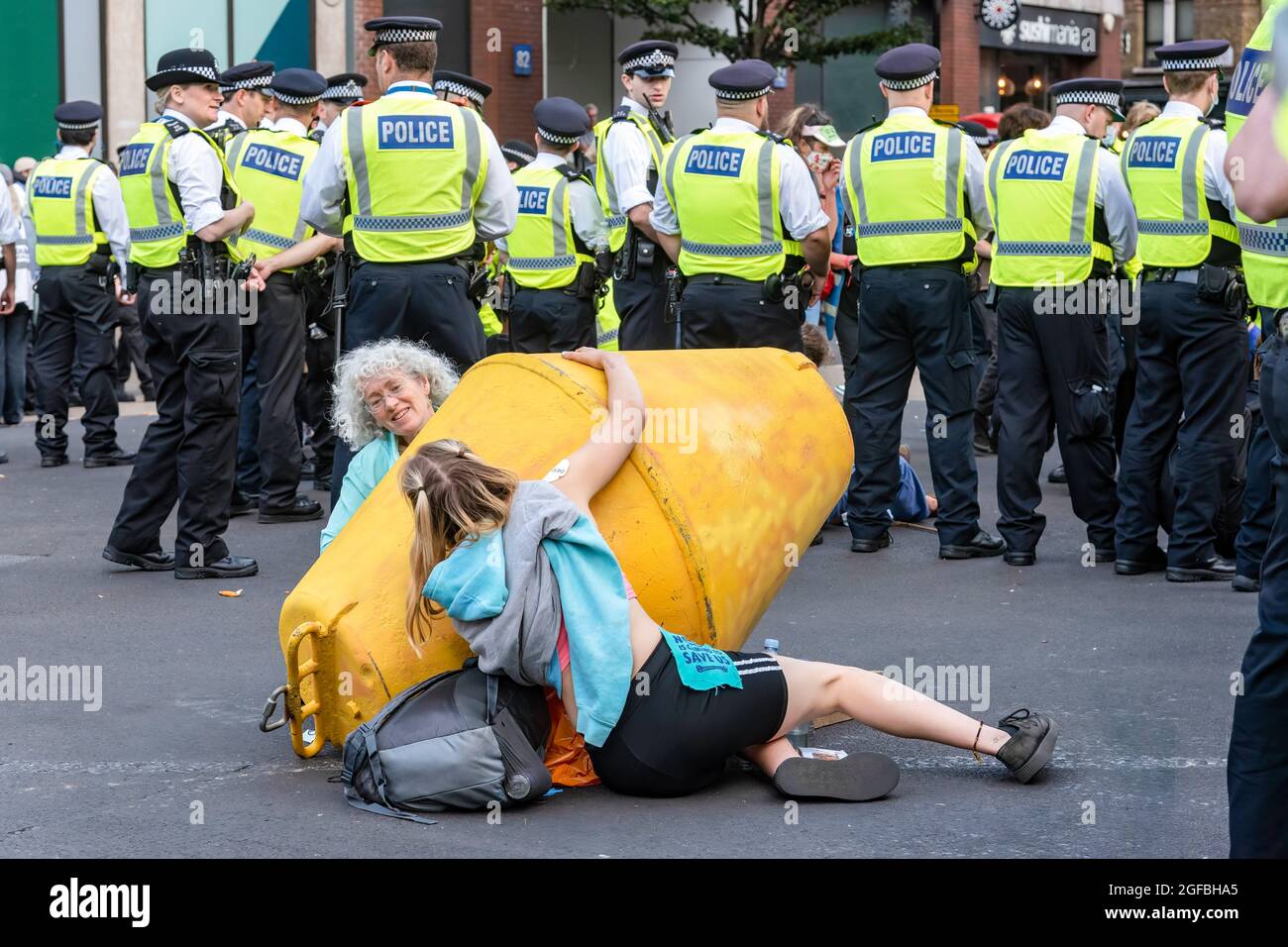 London, UK. 24th Aug, 2021. Protesters chained together at Cambridge Circus, during the demonstration.‘The Impossible Rebellion' protest against climate change, global warming, which plans to target the root cause of the climate and ecological crisis and to demand the government divest from fossil fuel companies by Extinction Rebellion. (Photo by Dave Rushen/SOPA Images/Sipa USA) Credit: Sipa USA/Alamy Live News Stock Photo