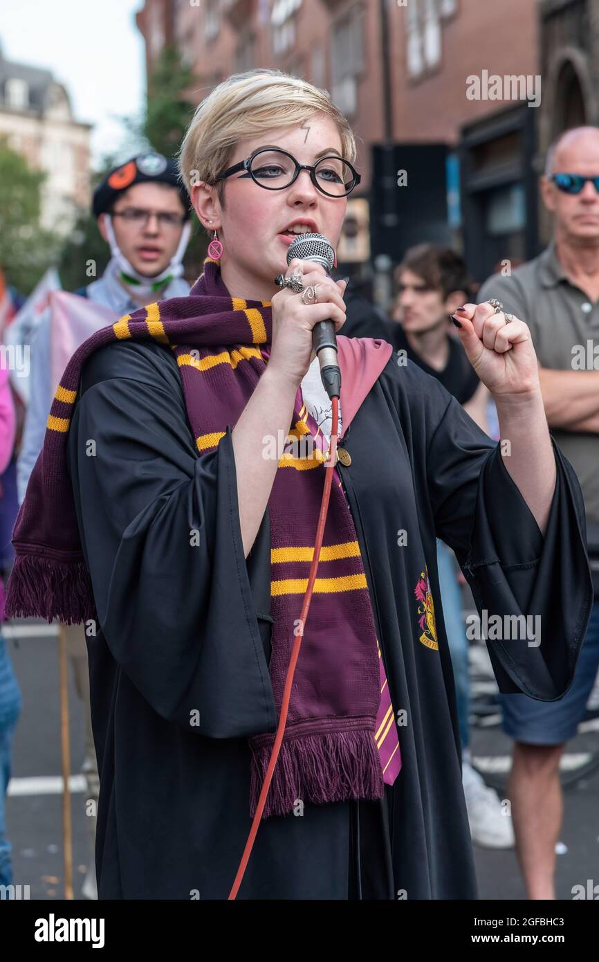 London, UK. 24th Aug, 2021. A speaker dressed as Harry Potter, addresses protesters gathered at Cambridge Circus, during the demonstration.‘The Impossible Rebellion' protest against climate change, global warming, which plans to target the root cause of the climate and ecological crisis and to demand the government divest from fossil fuel companies by Extinction Rebellion. (Photo by Dave Rushen/SOPA Images/Sipa USA) Credit: Sipa USA/Alamy Live News Stock Photo