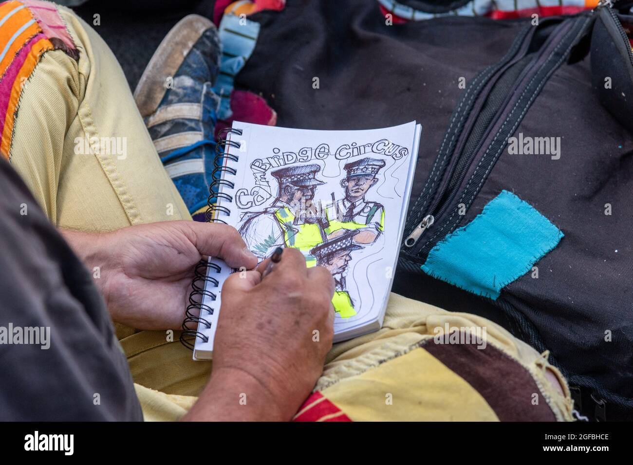 London, UK. 24th Aug, 2021. Sketches of police officers by a protester at Cambridge Circus, during the demonstration.‘The Impossible Rebellion' protest against climate change, global warming, which plans to target the root cause of the climate and ecological crisis and to demand the government divest from fossil fuel companies by Extinction Rebellion. (Photo by Dave Rushen/SOPA Images/Sipa USA) Credit: Sipa USA/Alamy Live News Stock Photo