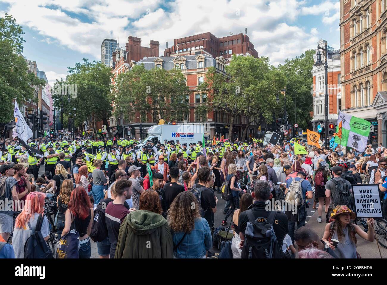 London, UK. 24th Aug, 2021. Police and Extinction Rebellion protesters at Cambridge Circus during the demonstration.‘The Impossible Rebellion' protest against climate change, global warming, which plans to target the root cause of the climate and ecological crisis and to demand the government divest from fossil fuel companies by Extinction Rebellion. (Photo by Dave Rushen/SOPA Images/Sipa USA) Credit: Sipa USA/Alamy Live News Stock Photo
