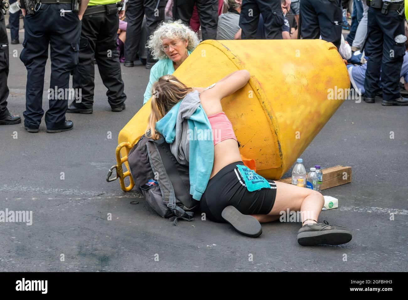 London, UK. 24th Aug, 2021. Protesters chained together at Cambridge Circus, during the demonstration.‘The Impossible Rebellion' protest against climate change, global warming, which plans to target the root cause of the climate and ecological crisis and to demand the government divest from fossil fuel companies by Extinction Rebellion. (Photo by Dave Rushen/SOPA Images/Sipa USA) Credit: Sipa USA/Alamy Live News Stock Photo