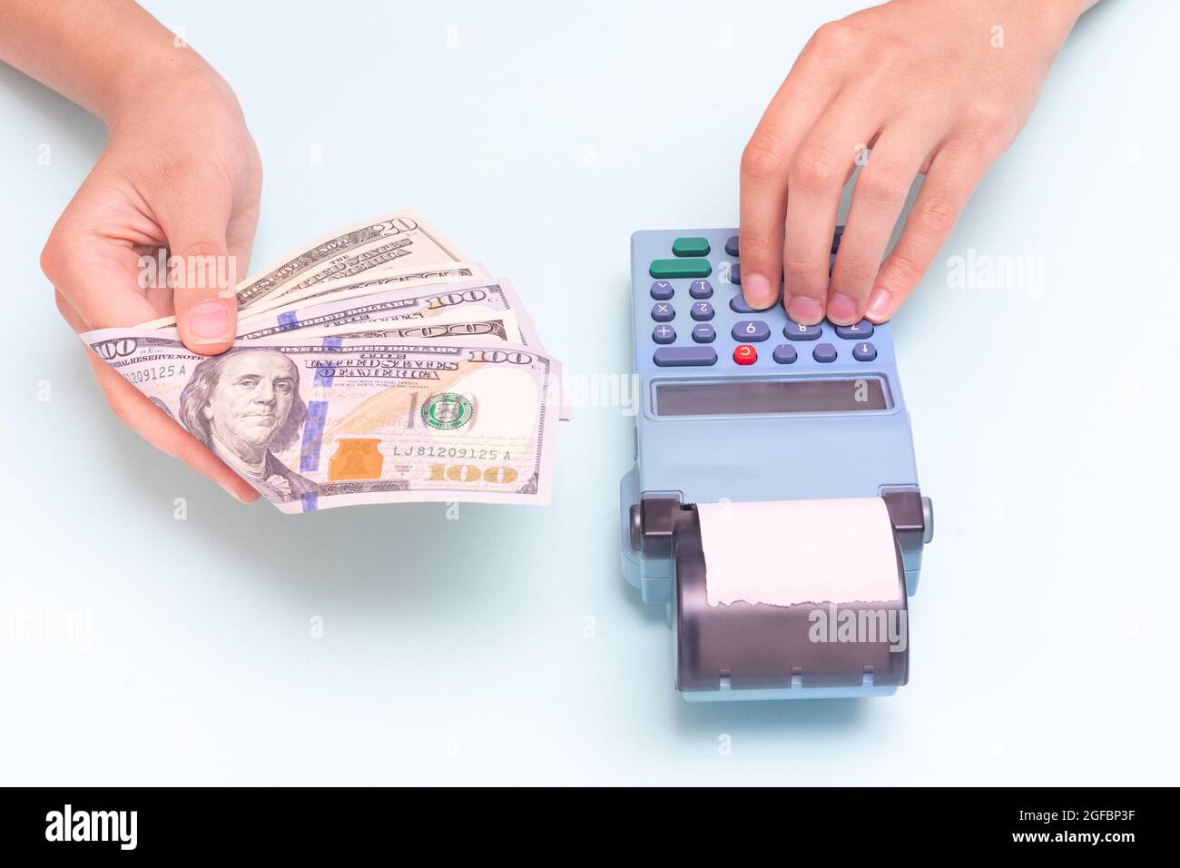 Payment for purchases in cash, dollars. Closeup of a hand giving cash