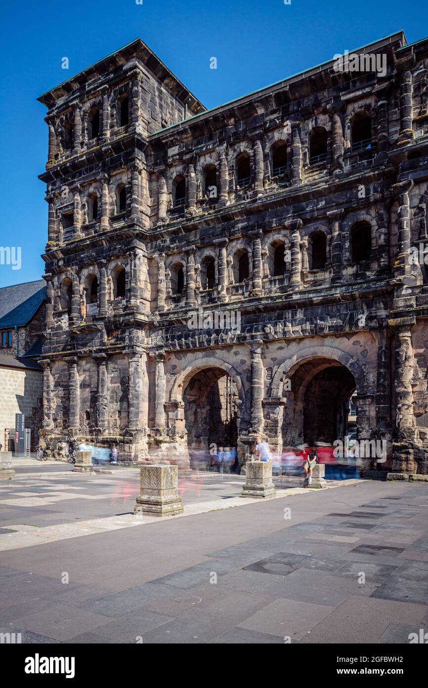 tourists in front of Porta Nigra, the large roman city gate in Trier, Rhineland-Palatinate, Germany Stock Photo