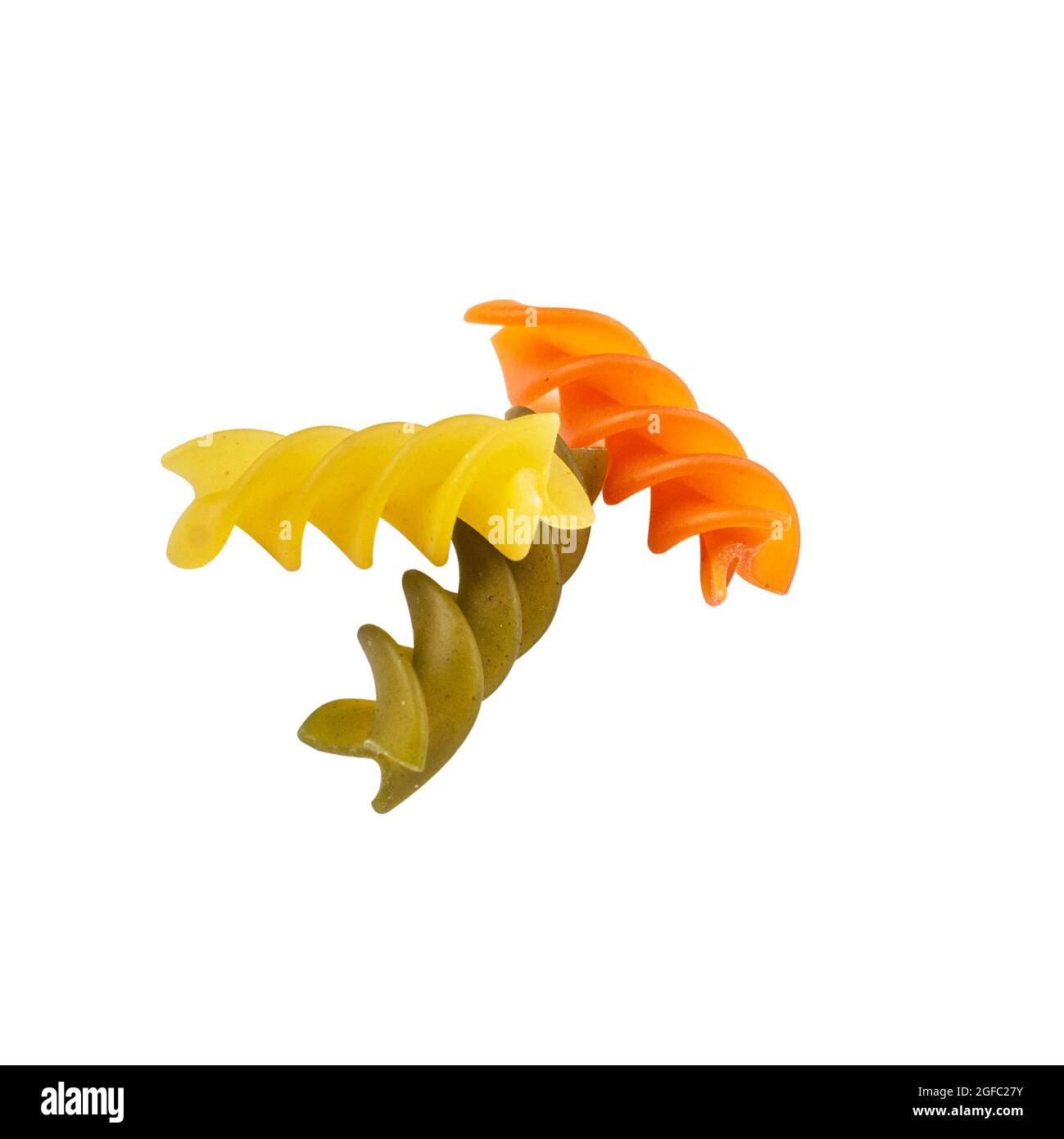 Raw tricolor Fusilli gluten free pasta isolated on white background