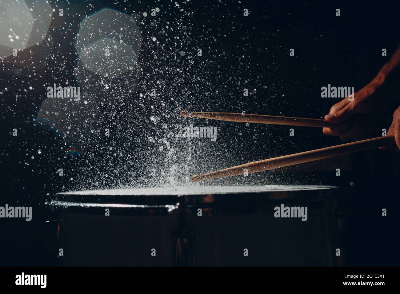 Close up drum sticks drumming hit beat rhythm on drum surface with