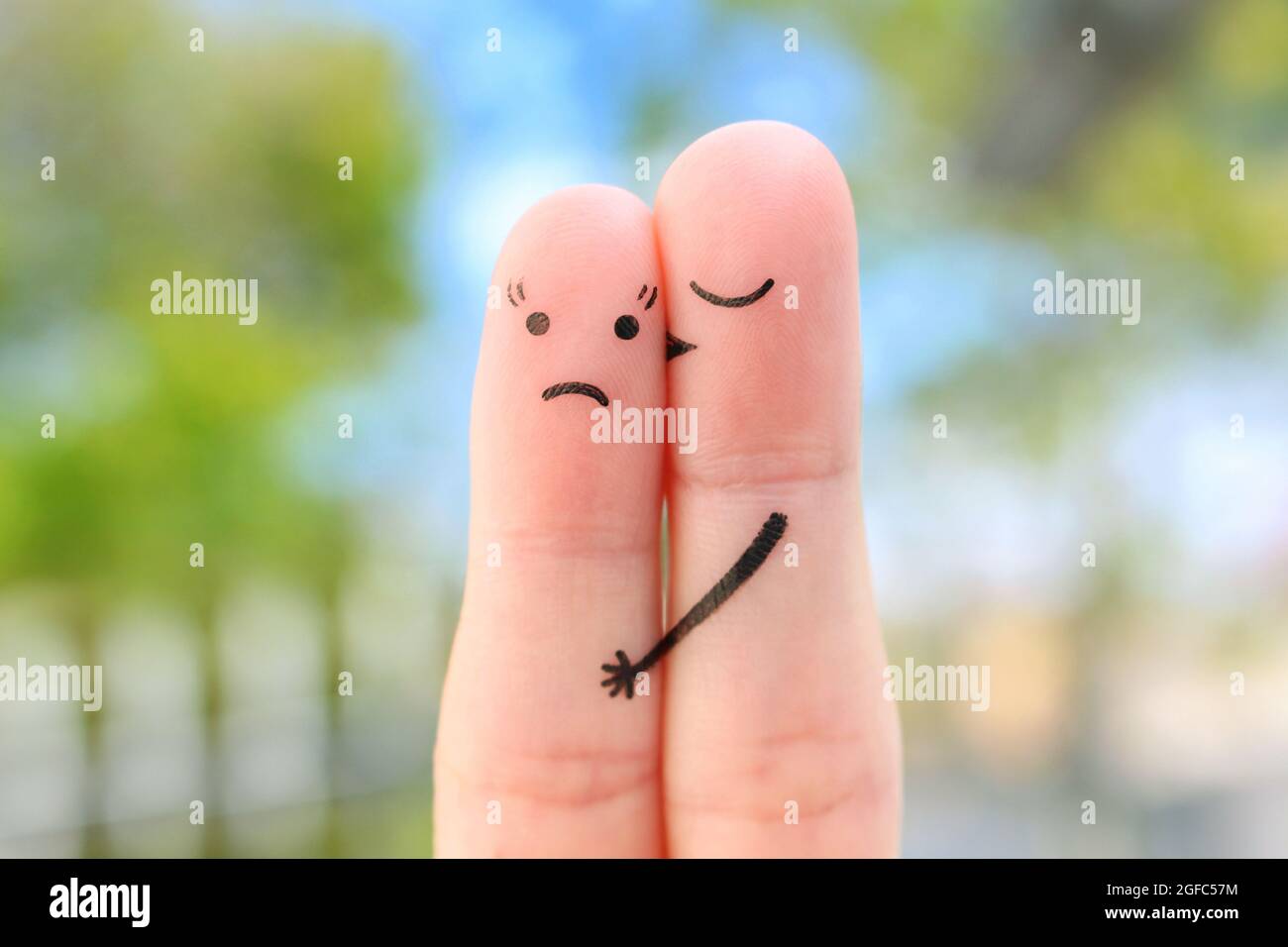 Fingers art of couple. Concept of woman doesn't like the man who loves her. Stock Photo
