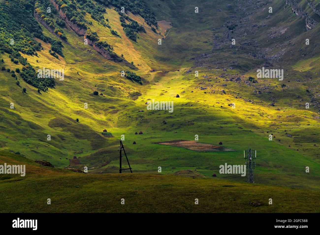 Sunlight on a valley in the mountains Stock Photo