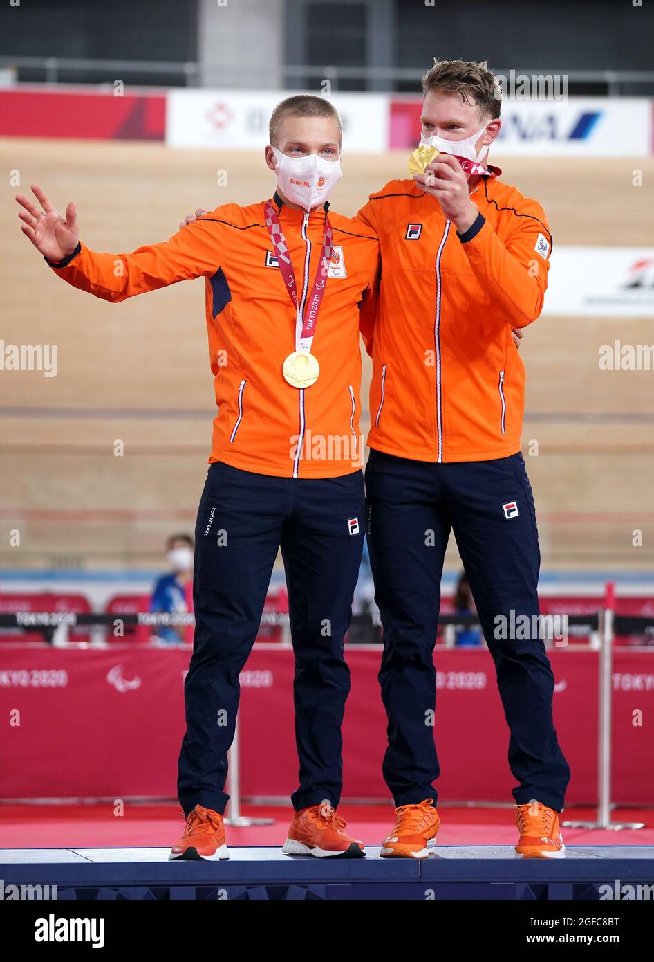 Netherland's Tristan Bangma with pilot Patrick Bos celebrate with their gold medals after the Men's B 4000m Individual Pursuit Final at the Izu Velodrome on day one of the Tokyo 2020 Paralympic Games in Japan. Picture date: Wednesday August 25, 2021. Stock Photo