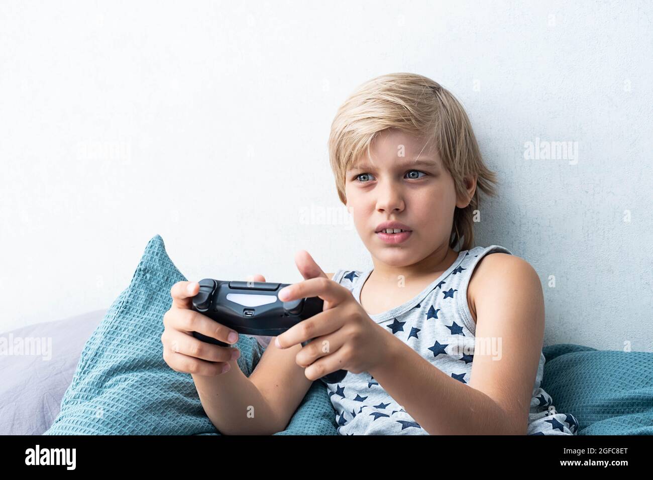 Smiling young child with video game controller Royalty-Free Stock Image -  Storyblocks