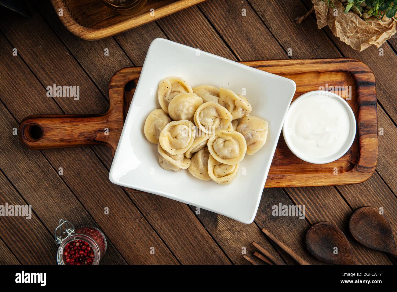 Russian pelmeni dumplings with sour cream Stock Photo