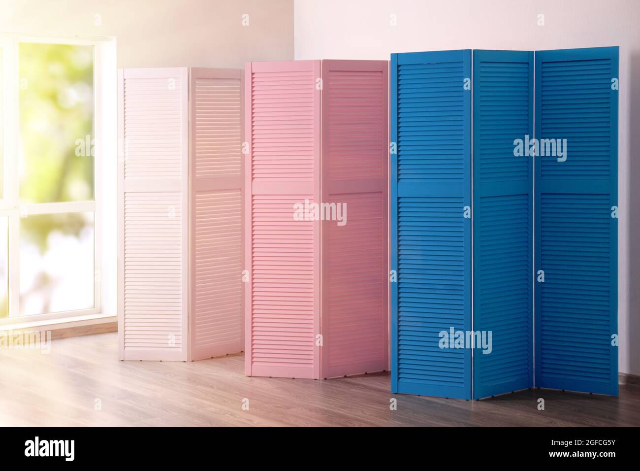 Color folding screens in room Stock Photo Alamy